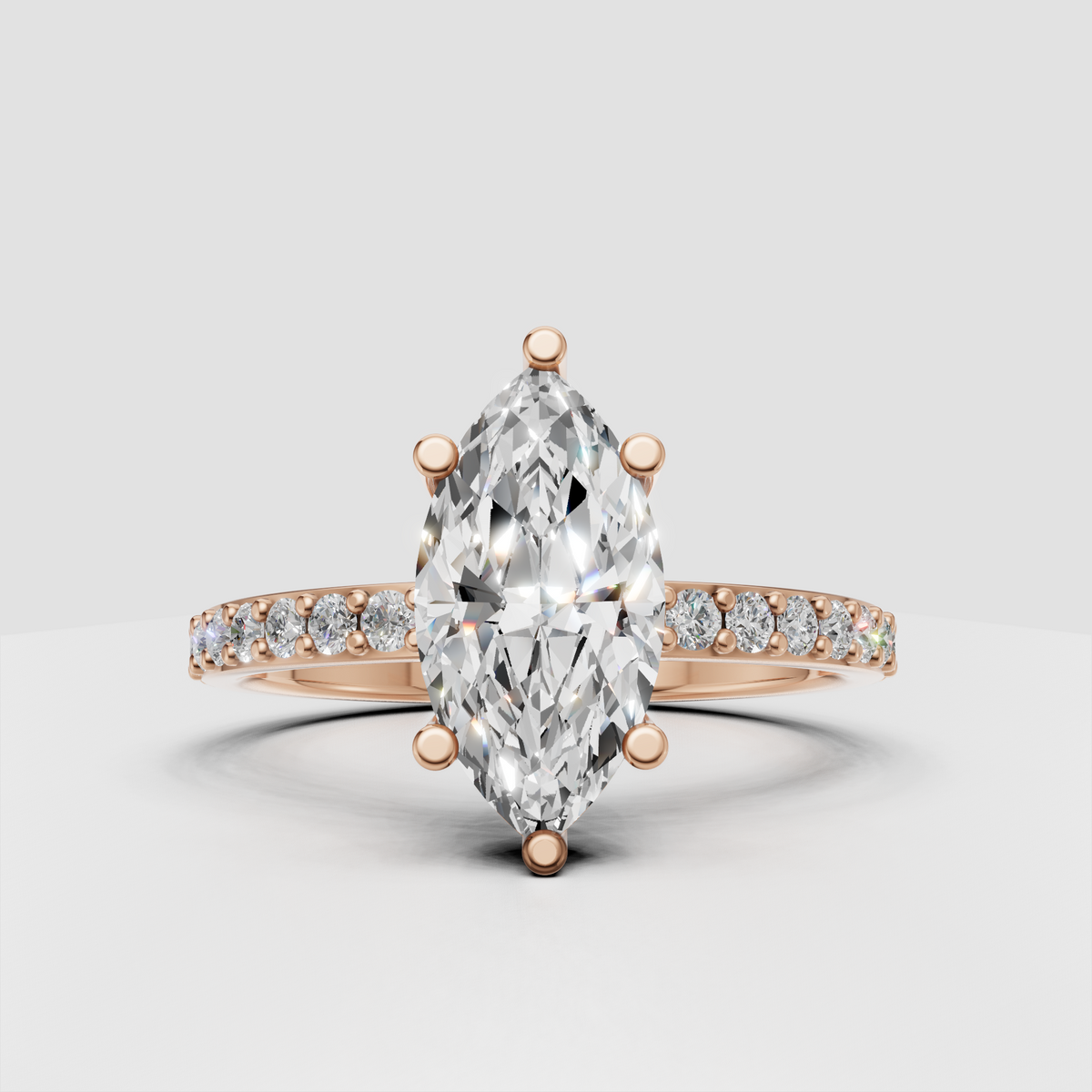 Marquise solitaire ring with brilliant round pave accent stones