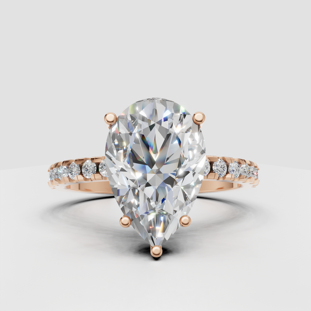 Elegant yellow gold pear-shaped Diamond ring with tapered shank