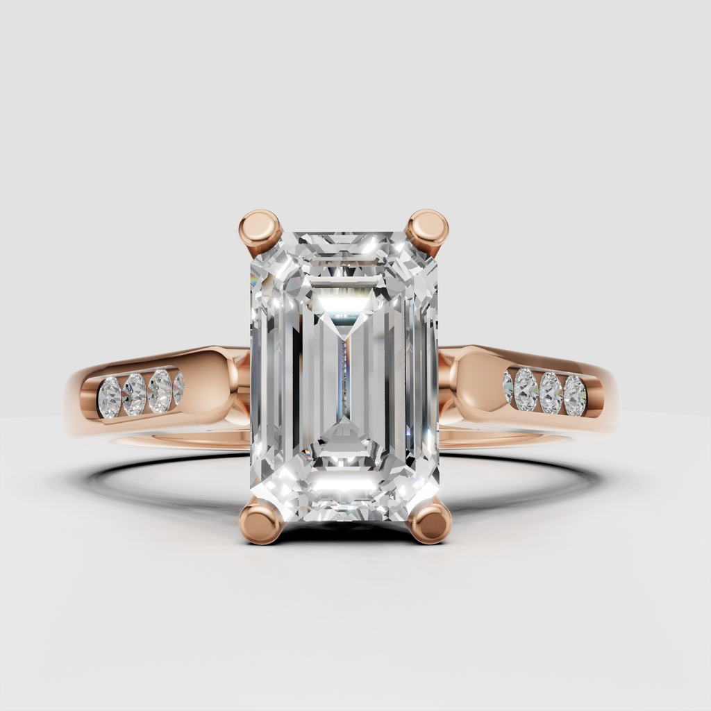 Modern emerald cut diamond engagement ring with architectural shoulders.