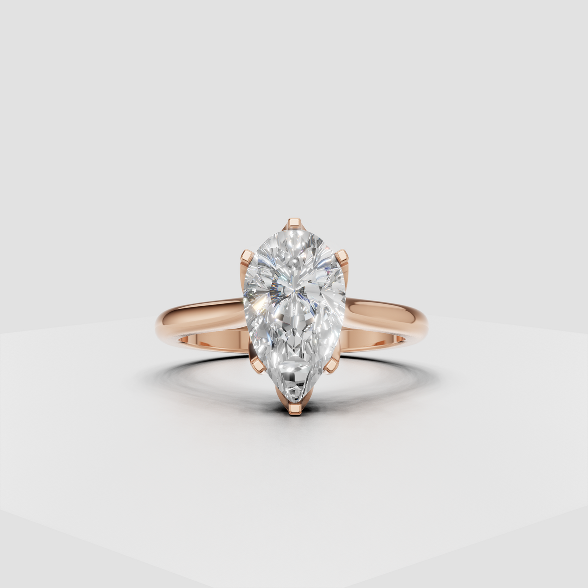 Top view of elongated pear-shaped diamond engagement ring