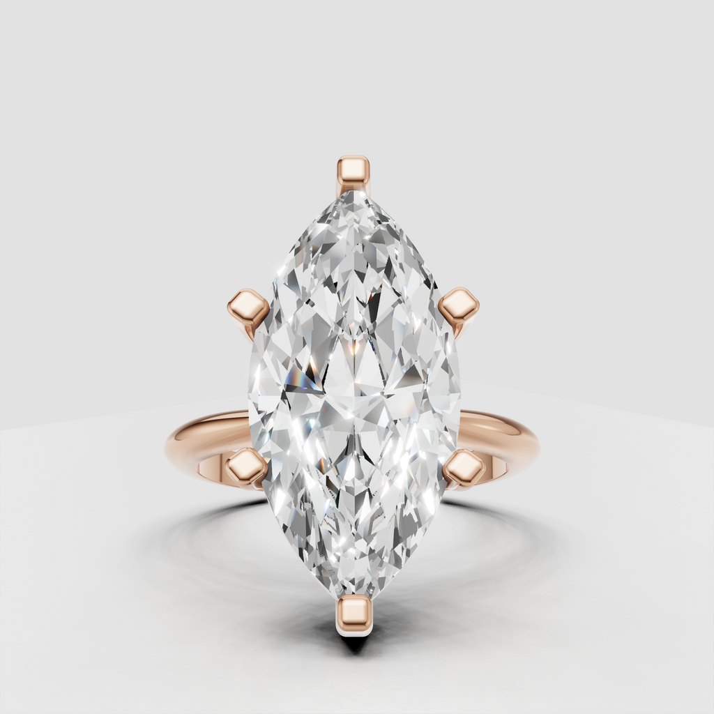 Elongated marquise canter diamond in six-prong gold setting