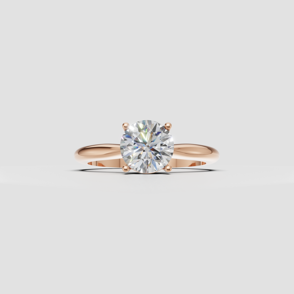 Round cut diamond engagement ring with smooth tapered yellow gold band