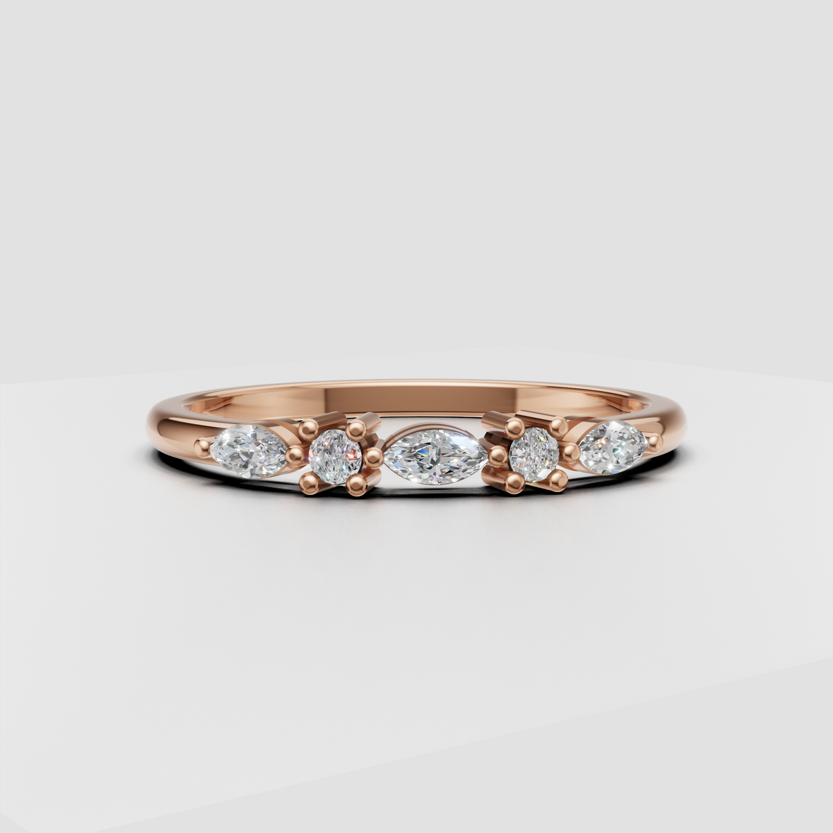 Luxury alternating round and marquise diamond band photographed on white background