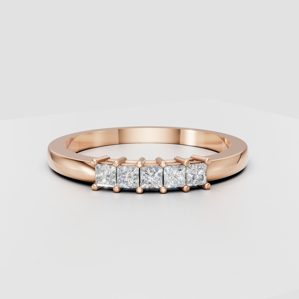Polished yellow gold ring featuring a row of square princess cut diamond stones