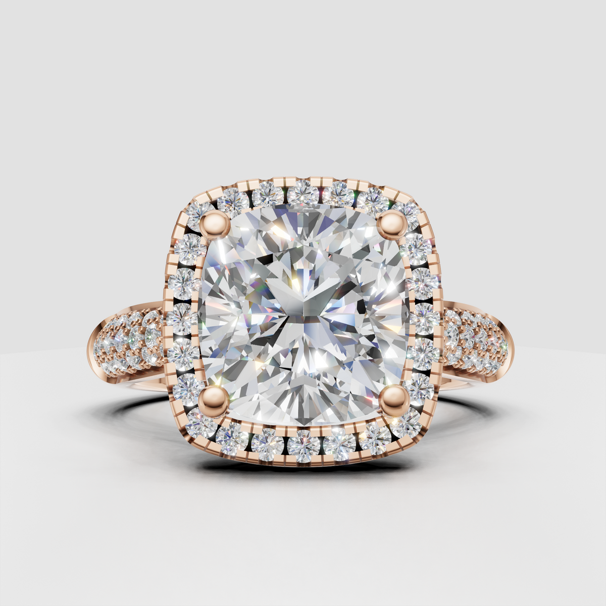 Four-prong cushion diamond halo ring with pavé band