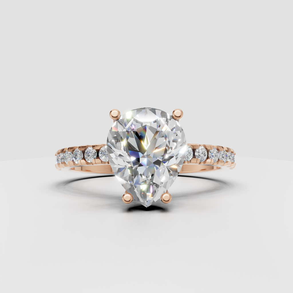 Pear diamond ring with polished gold band and pavé detailing