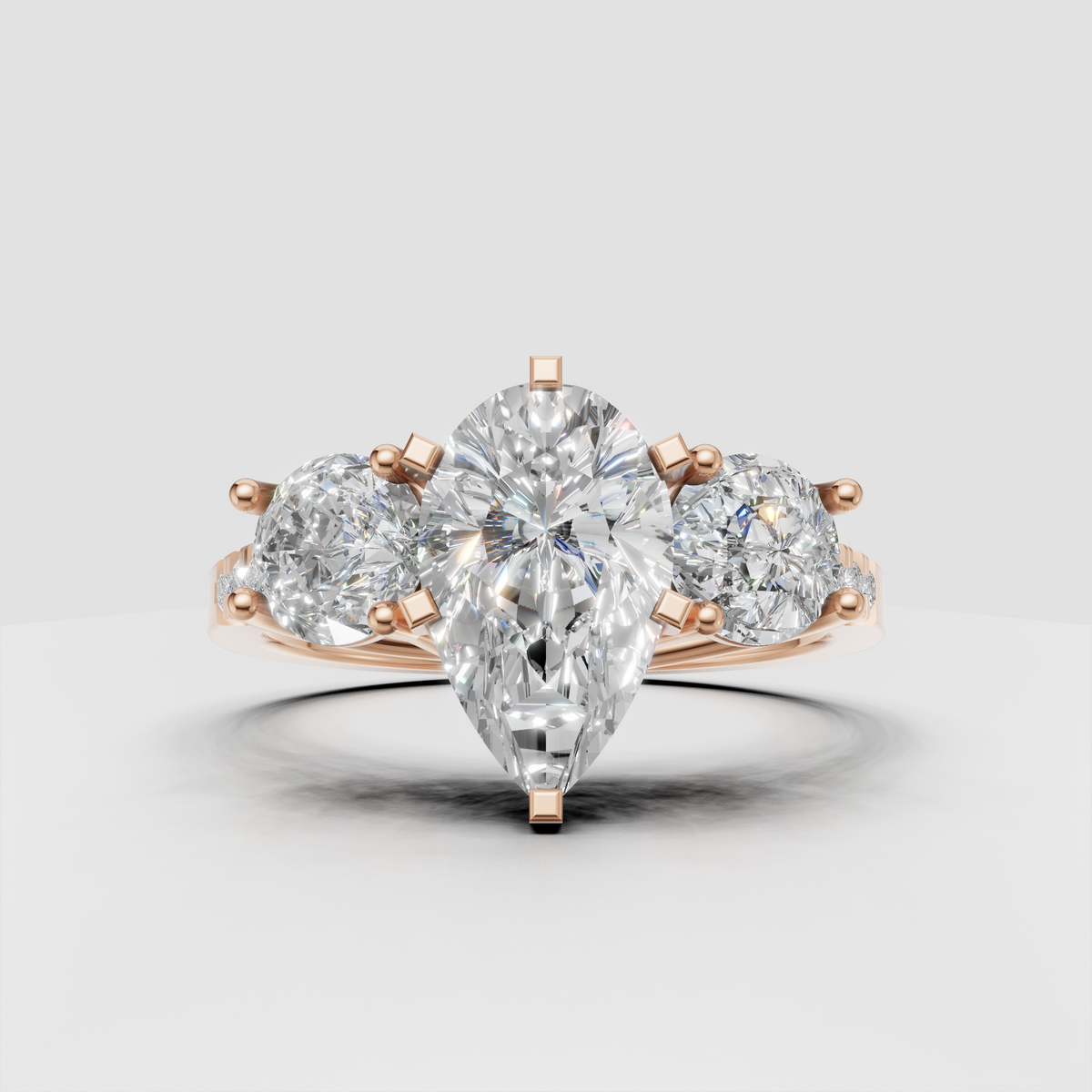 Luxury three stone diamond ring with pear shaped center stone