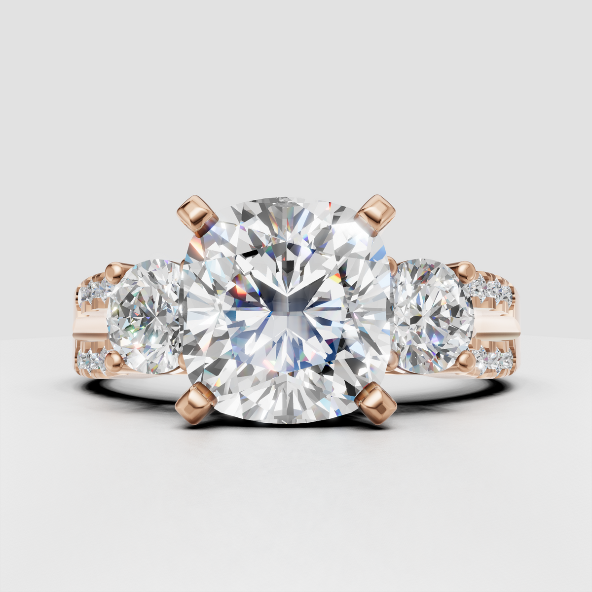 Yellow gold three stone diamond ring with pavé shoulder accents
