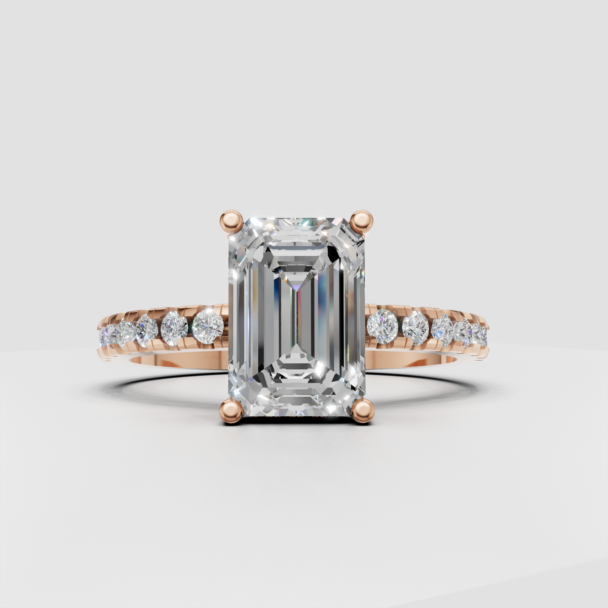 Emerald diamond ring featuring four-prong center setting