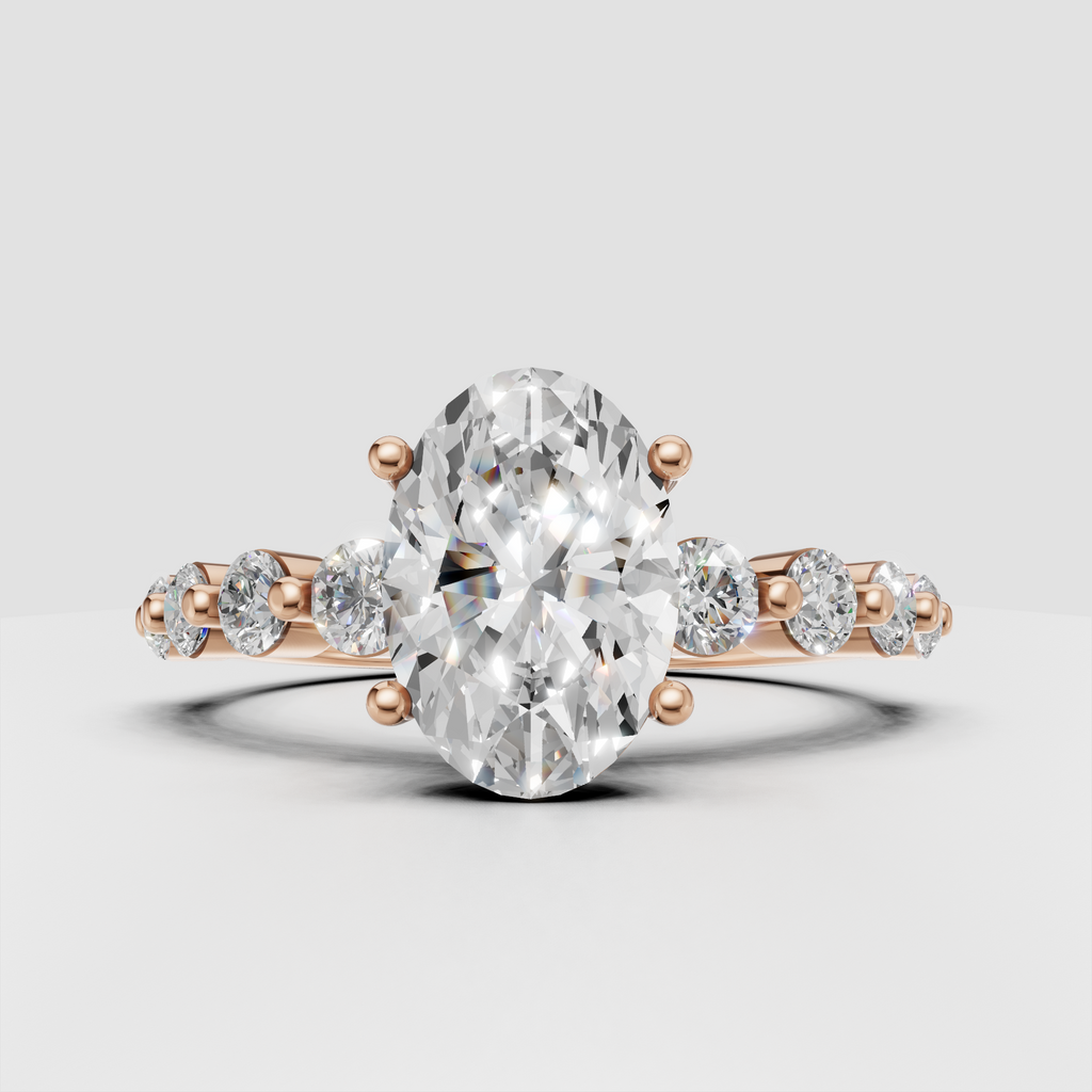 Oval cut diamond bridal ring with cathedral shoulders and diamond accented band