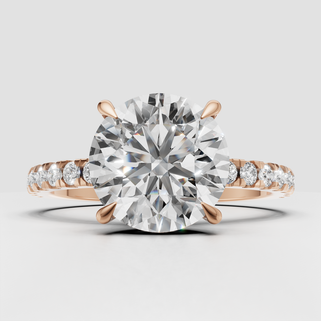 Classic round brilliant diamond ring with pavé setting