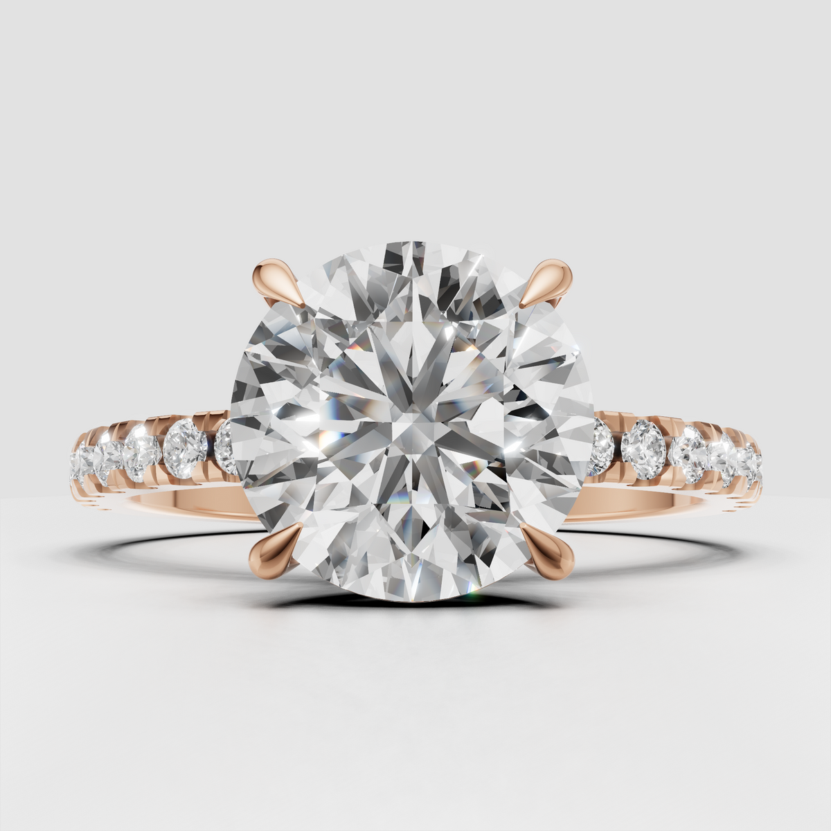 Classic round brilliant diamond ring with pavé setting