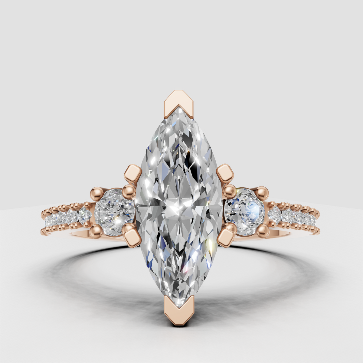 Marquise diamond ring with multiple prongs and pave band detailing