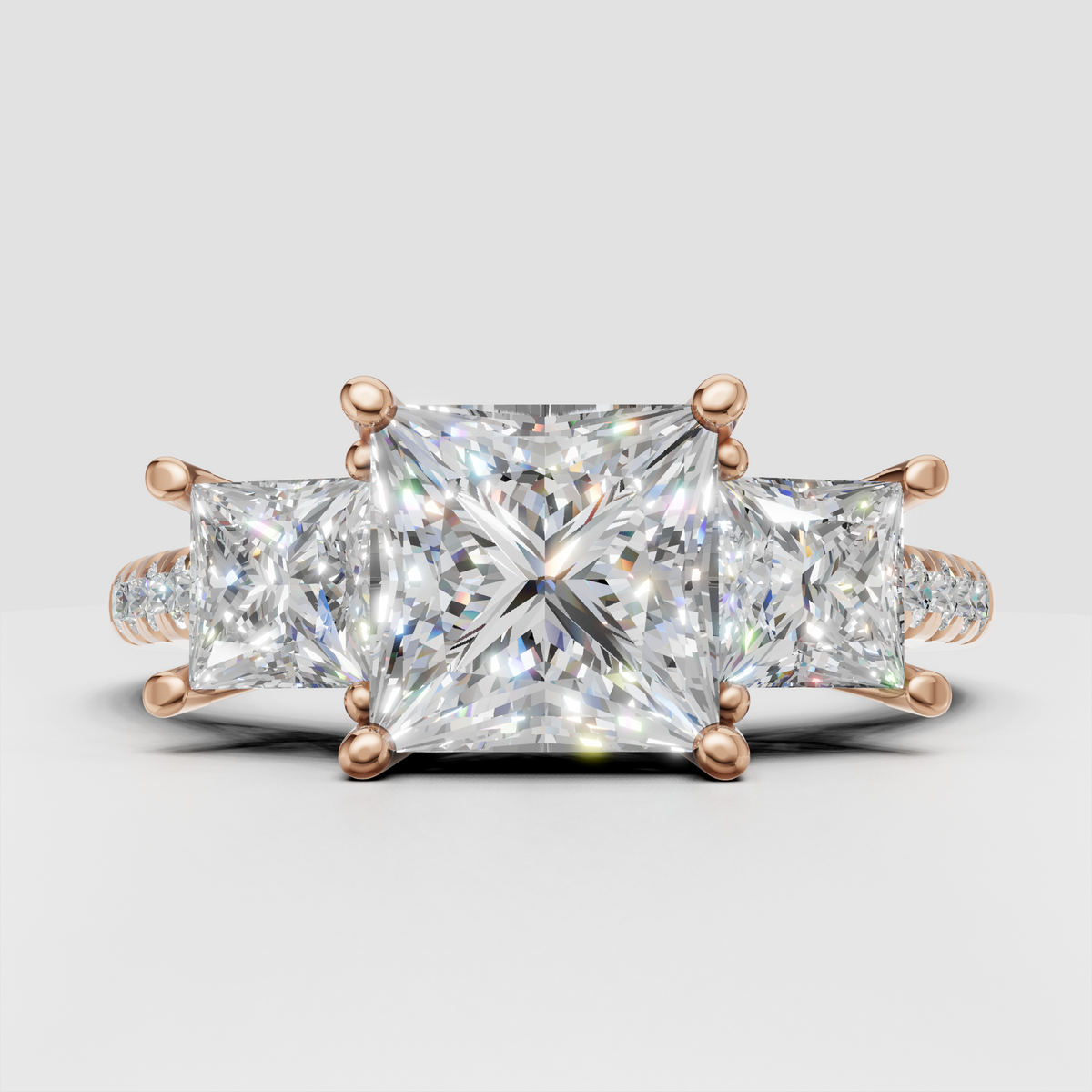 Princess cut center diamond ring with side stones and round pave diamonds