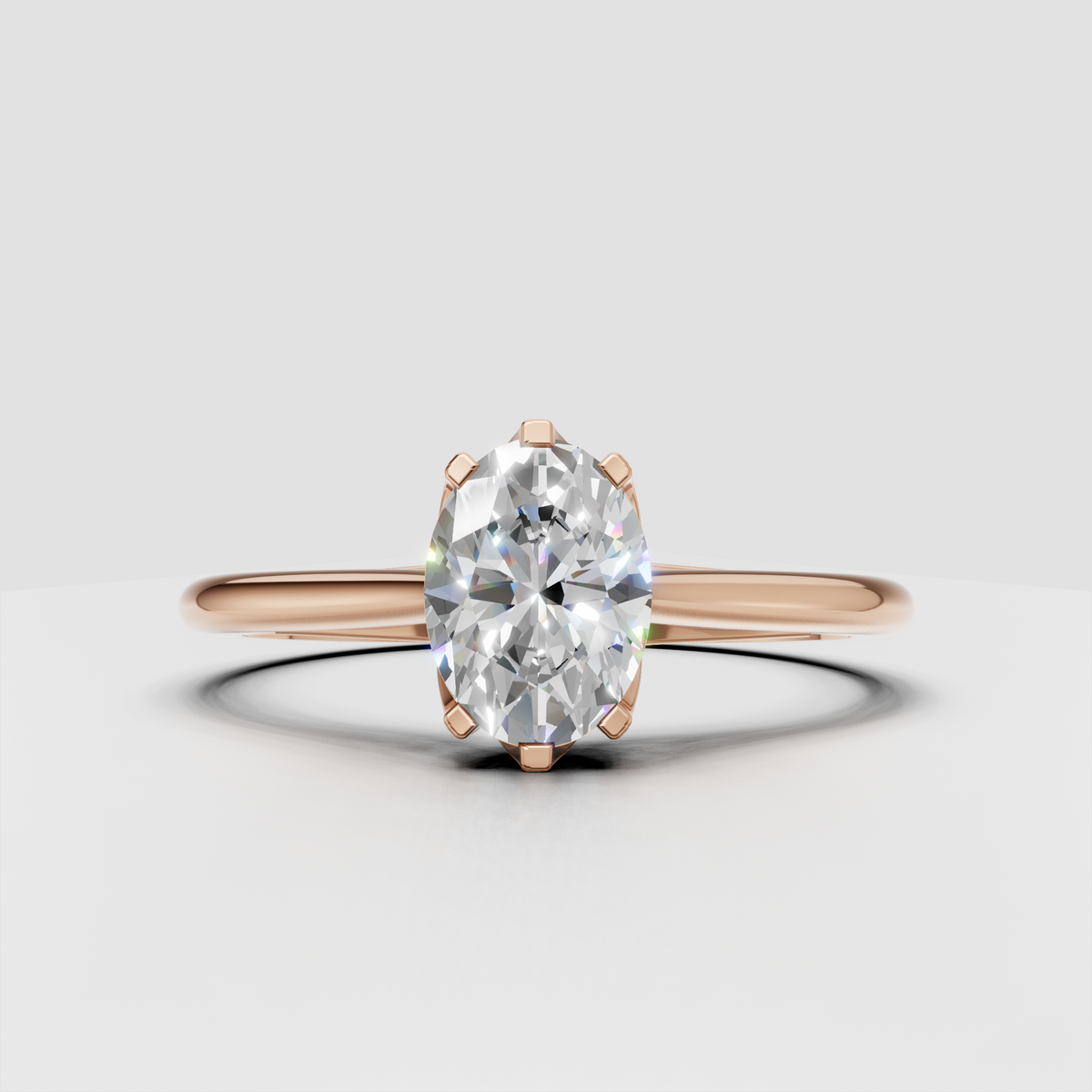 Oval diamond ring featuring a sleek polished gold band