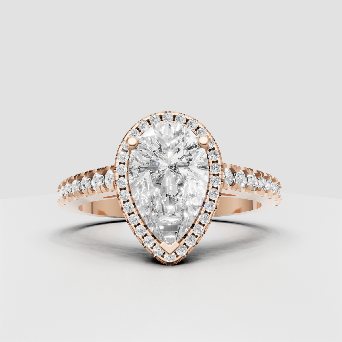Yellow gold pear diamond engagement ring with sparkling halo