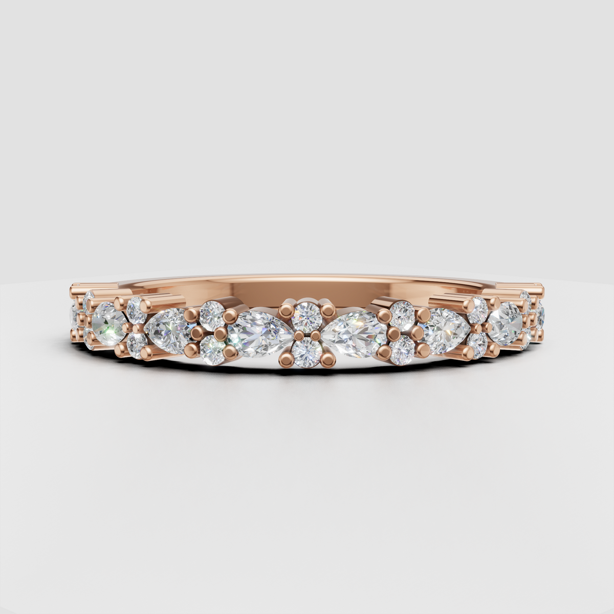 Perspective view of alternating pear and round diamond wedding ring