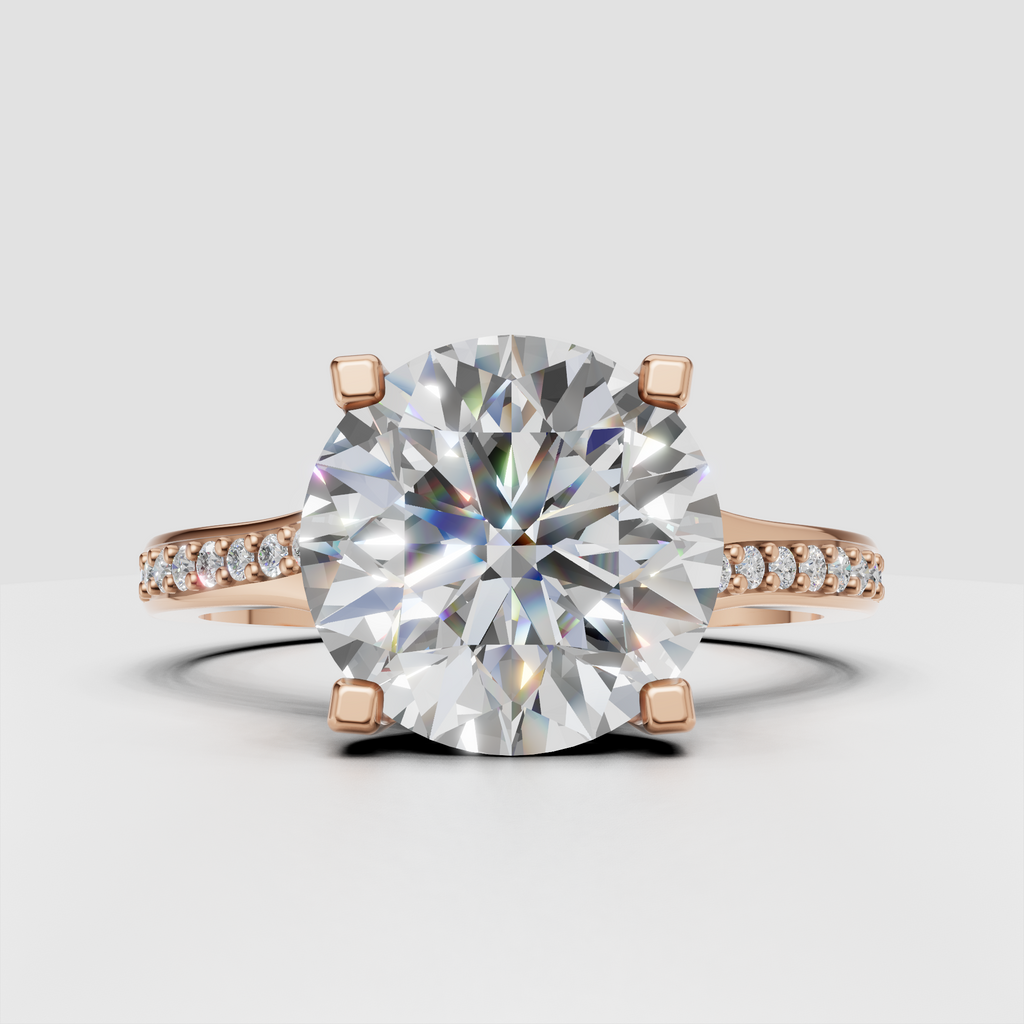 Four-prong round diamond ring with elegant cathedral shoulders