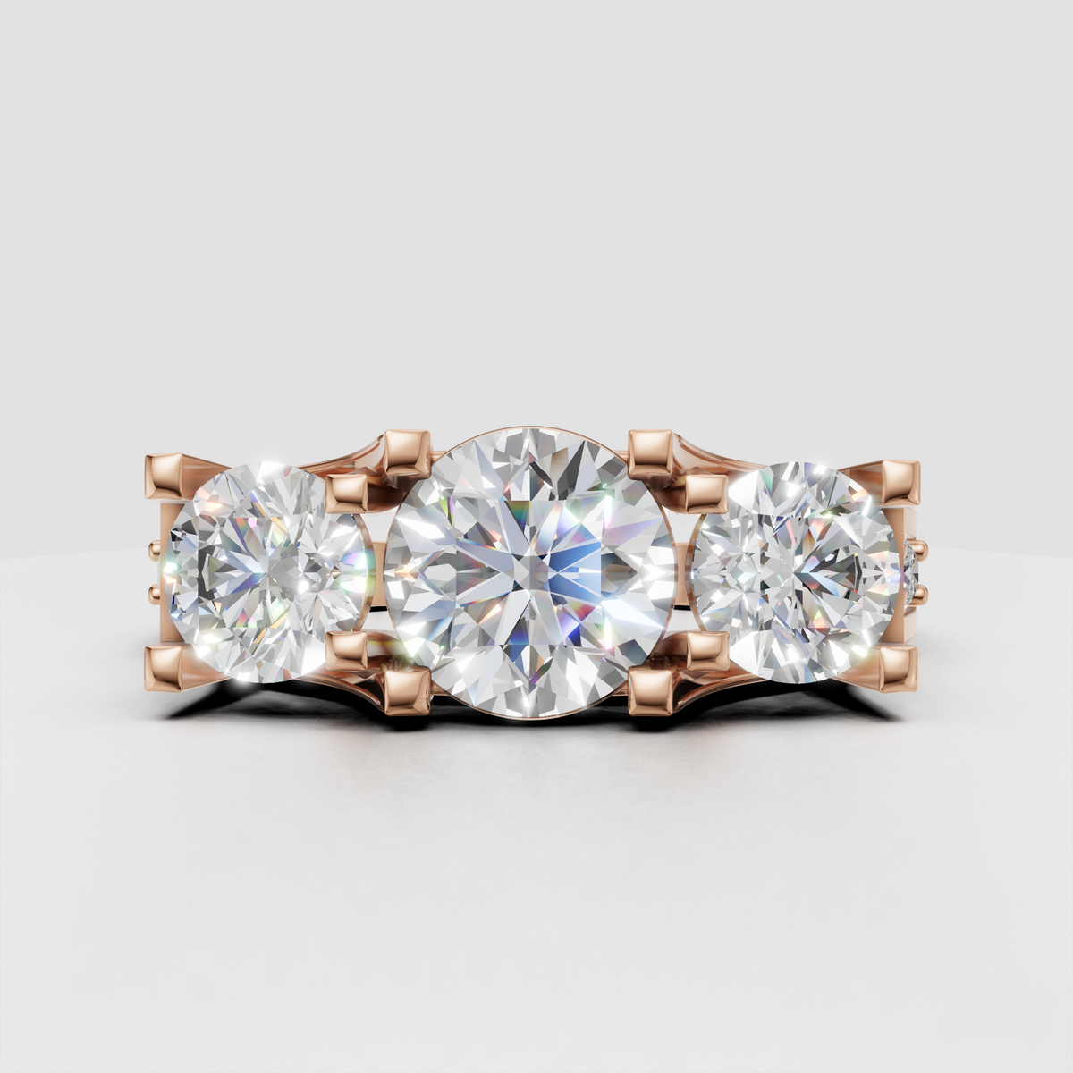 Round brilliant diamond ring with symmetrical three-stone setting