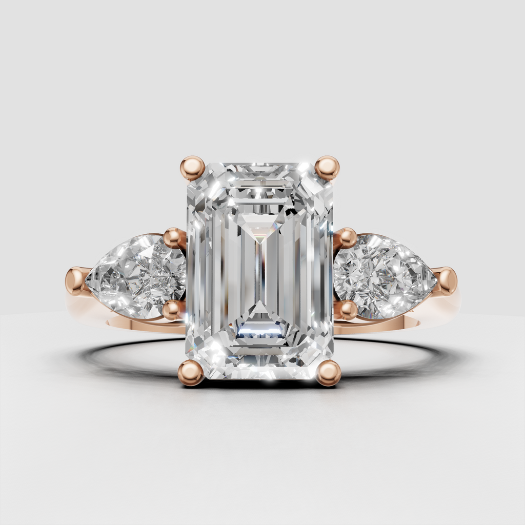 Emerald cut center diamond with pear-shaped side stones