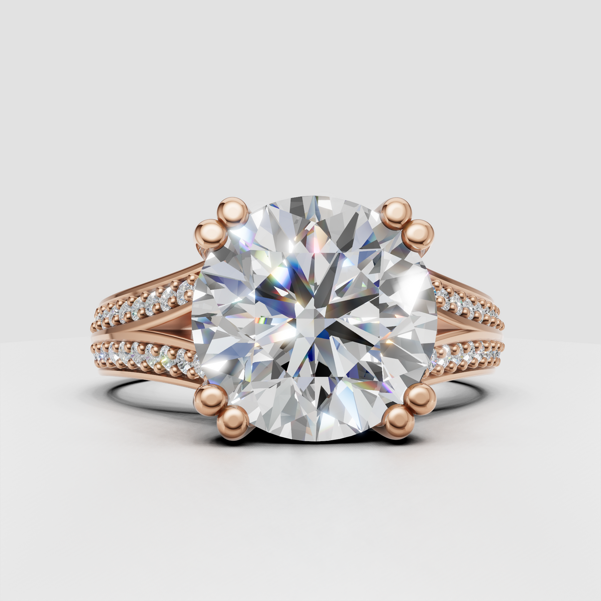 Round diamond ring featuring a double-row pavé split shank