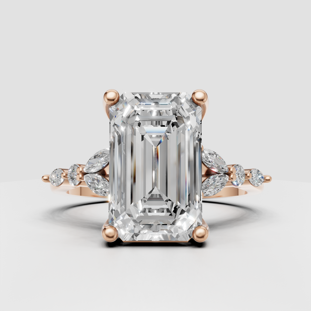 Emerald cut engagement ring with diamond accented shoulders
