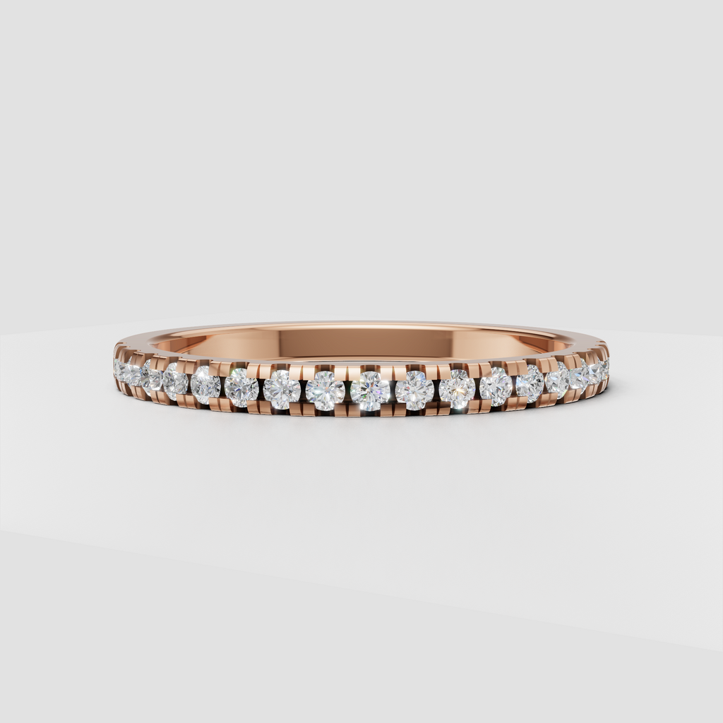 Close-up of round diamonds secured in a channel-style gold setting
