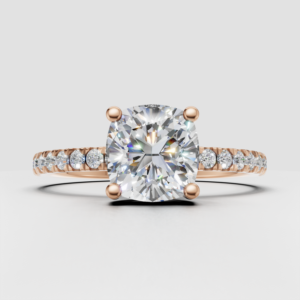 Cushion cut diamond with four-prong cathedral setting