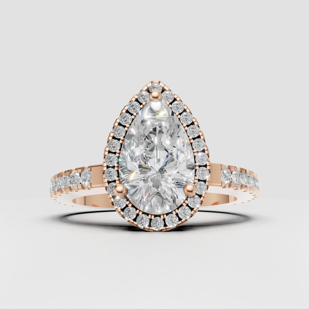 Sophisticated pear diamond ring with round stone halo