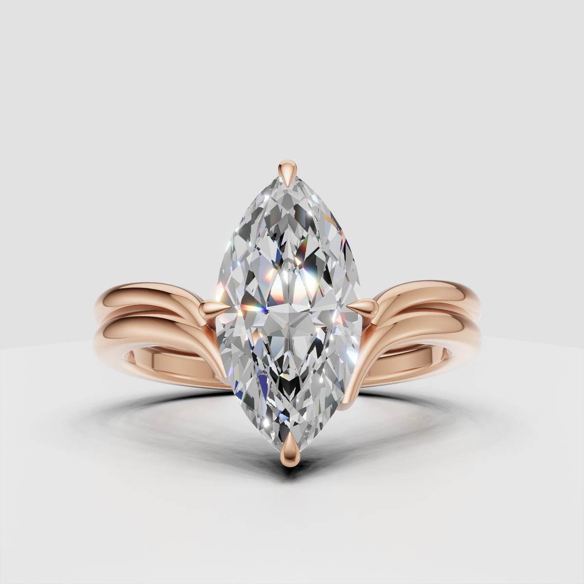 Marquise cut solitaire ring with sculpted four prong setting