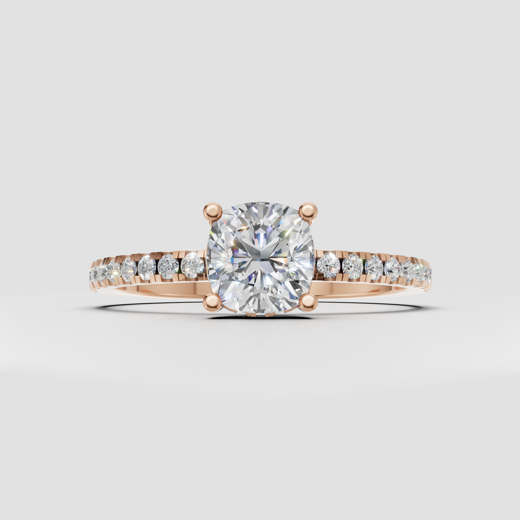 Cushion cut center stone with four rounded prongs and pave band