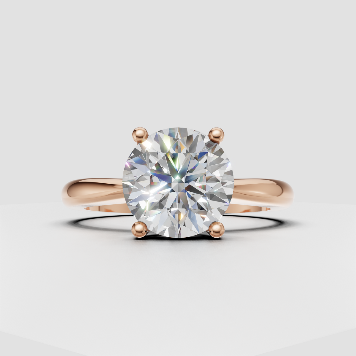 Timeless round diamond ring with four-prong solitaire setting