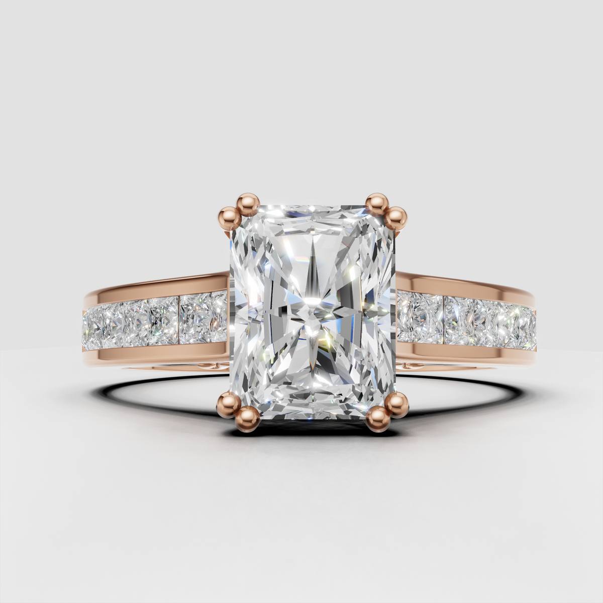 Radiant diamond engagement ring with wide gold band