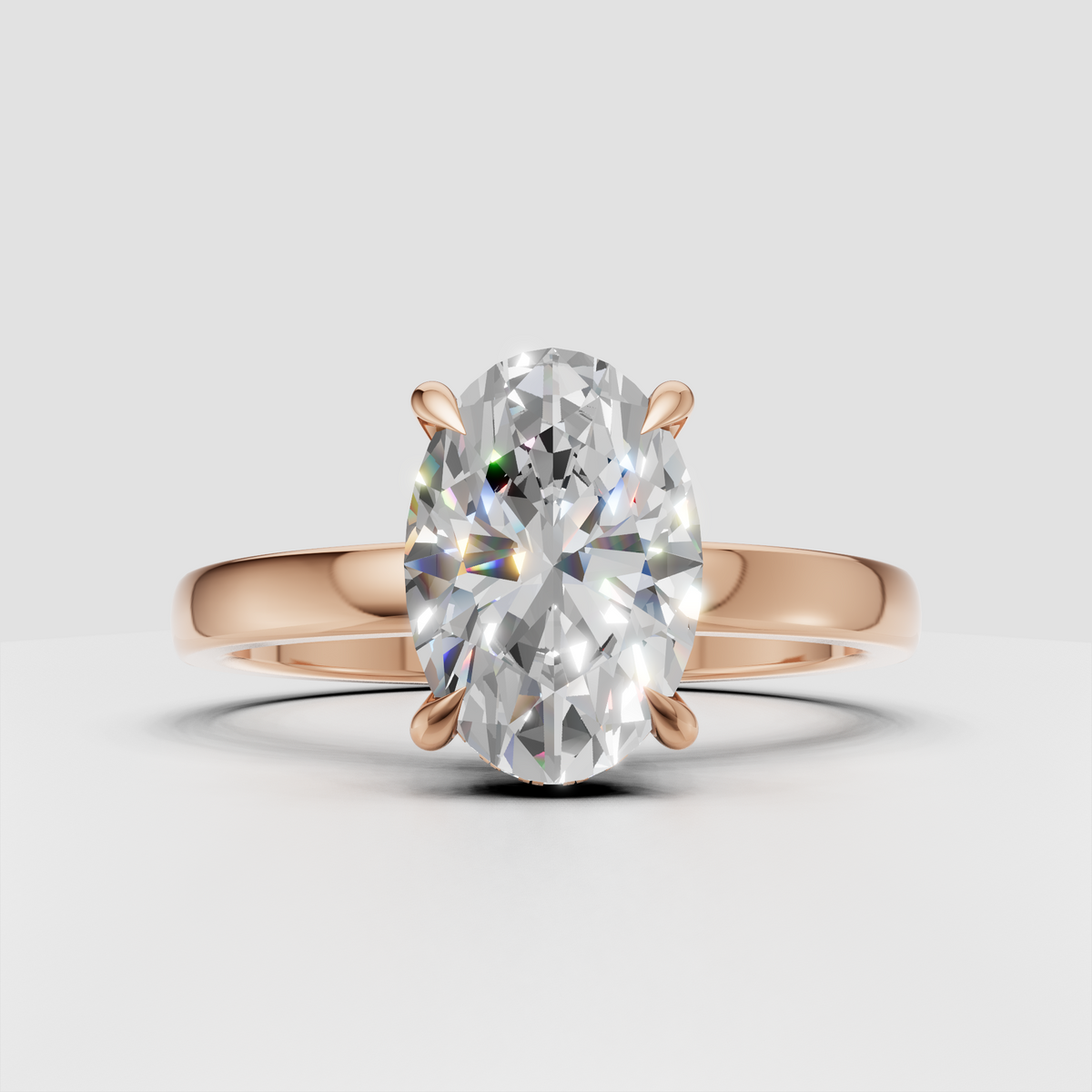 Oval solitaire diamond ring with polished gold band