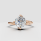 Round diamond engagement ring with sculptural prong setting