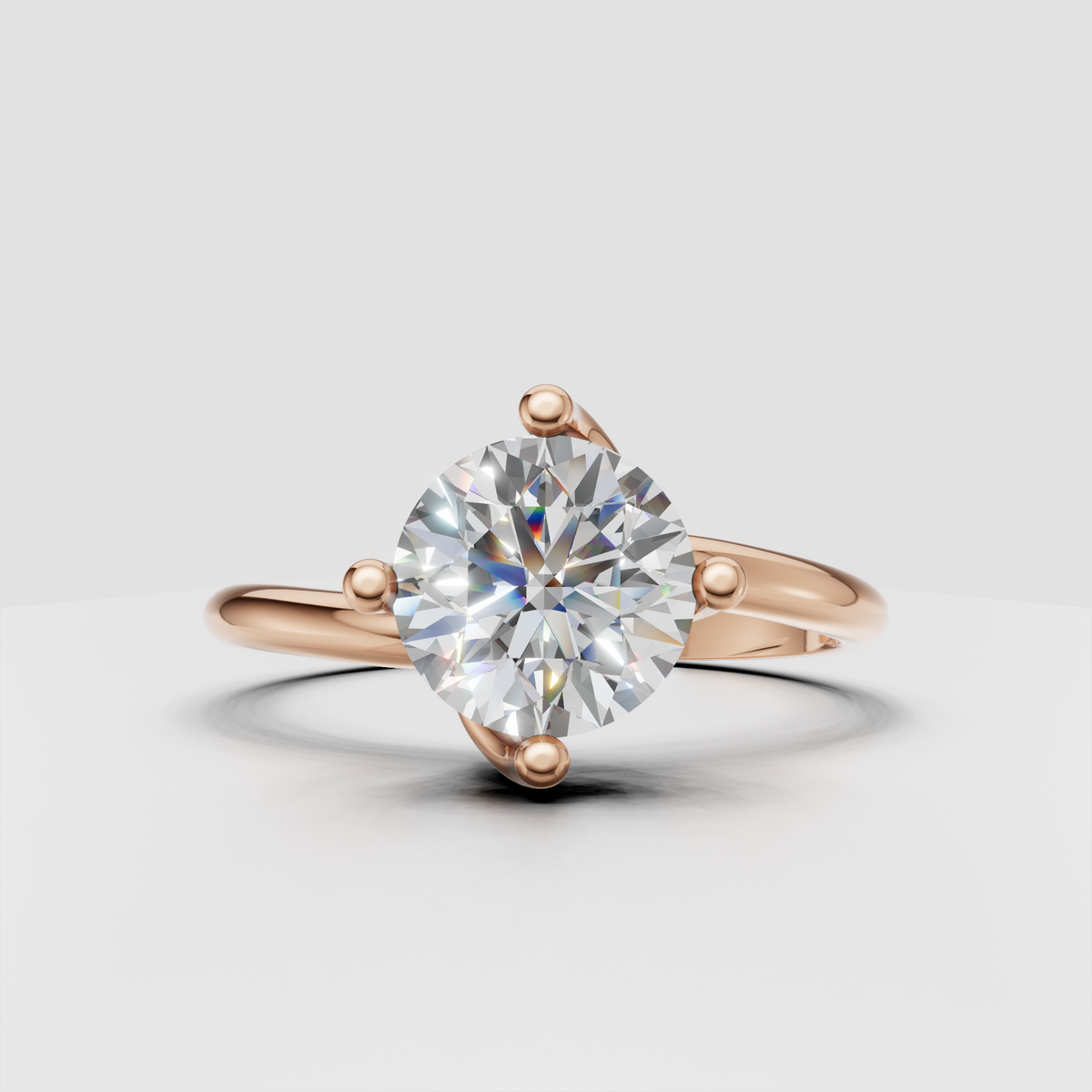Round diamond engagement ring with sculptural prong setting