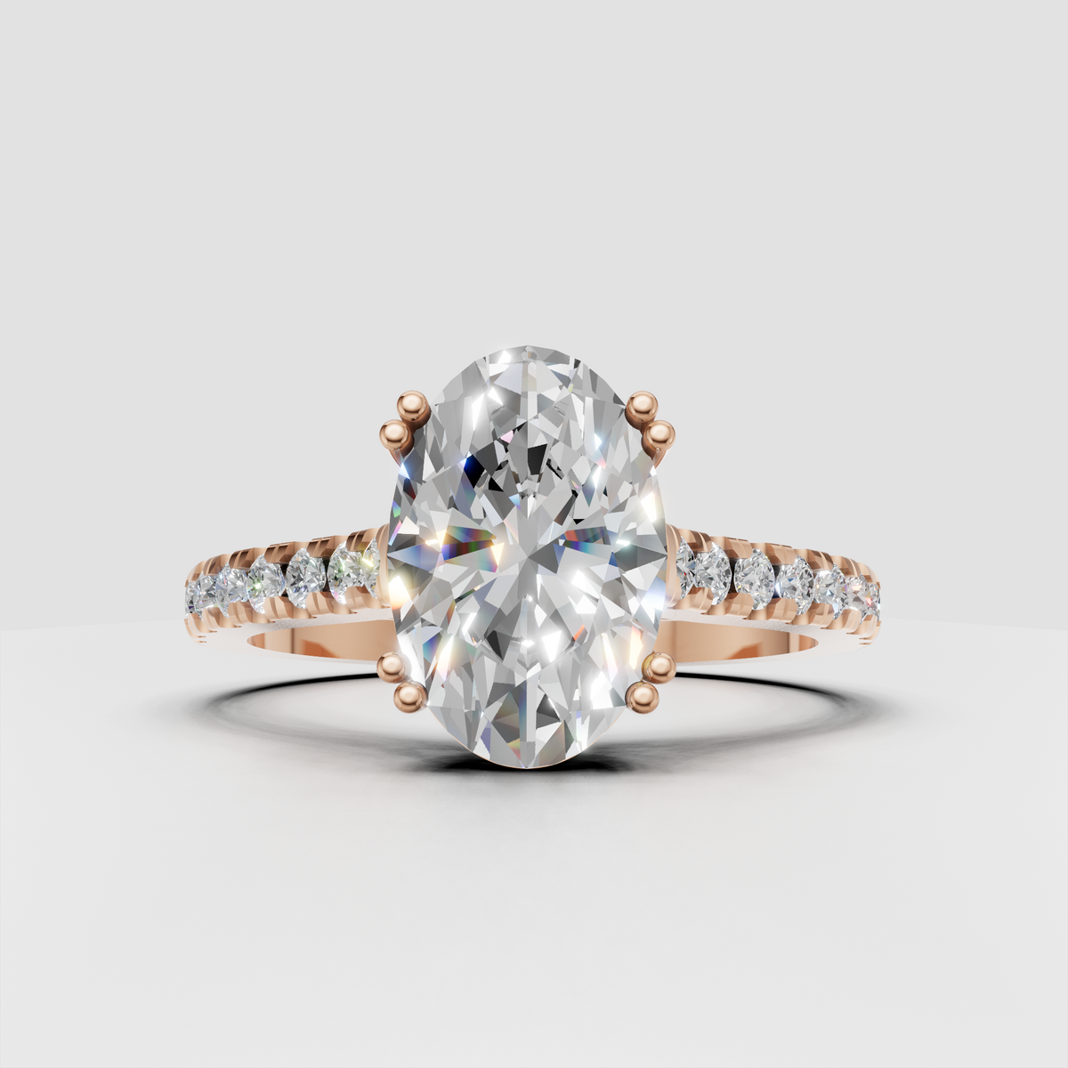 Elongated oval center stone ring with sparkling pave-set round accents
