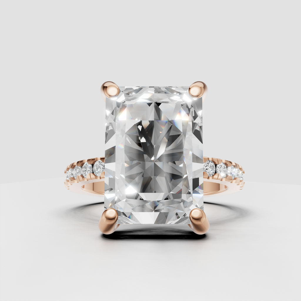 Close-up Radiant Diamond engagement ring with four-prong center setting