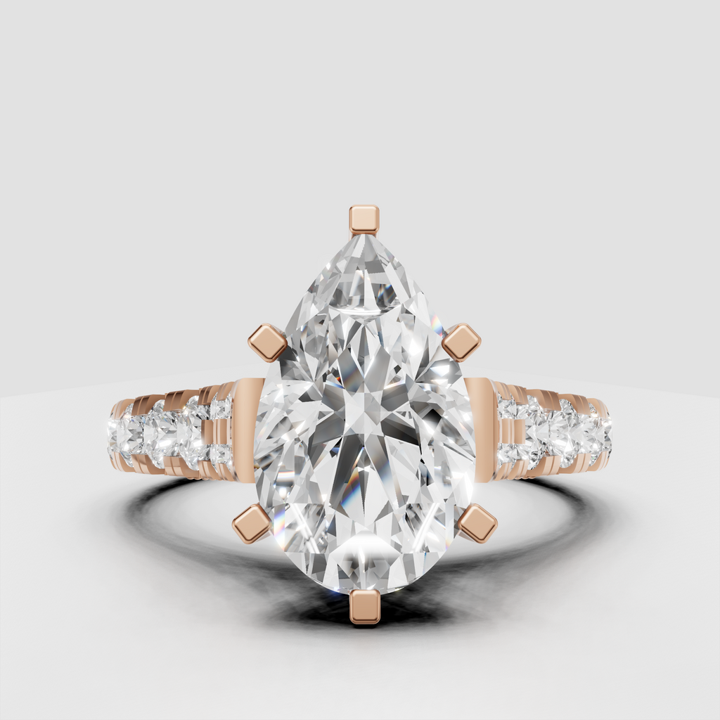 Yellow gold pear engagement ring with graduated pavé side stones