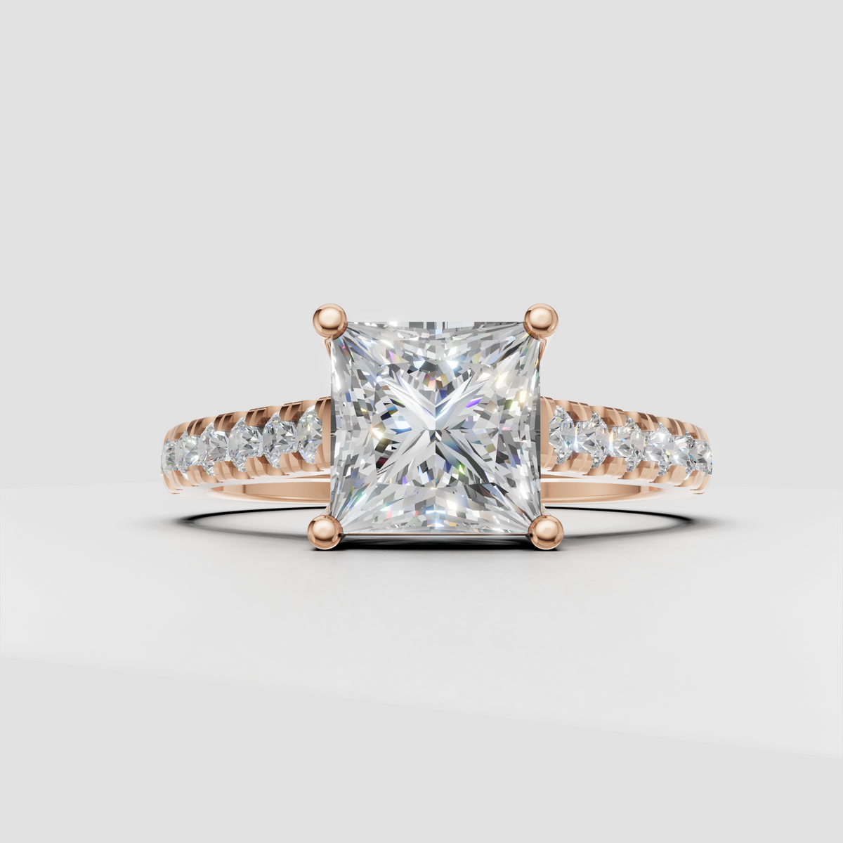 Square cut diamond ring with sculpted yellow gold shoulders