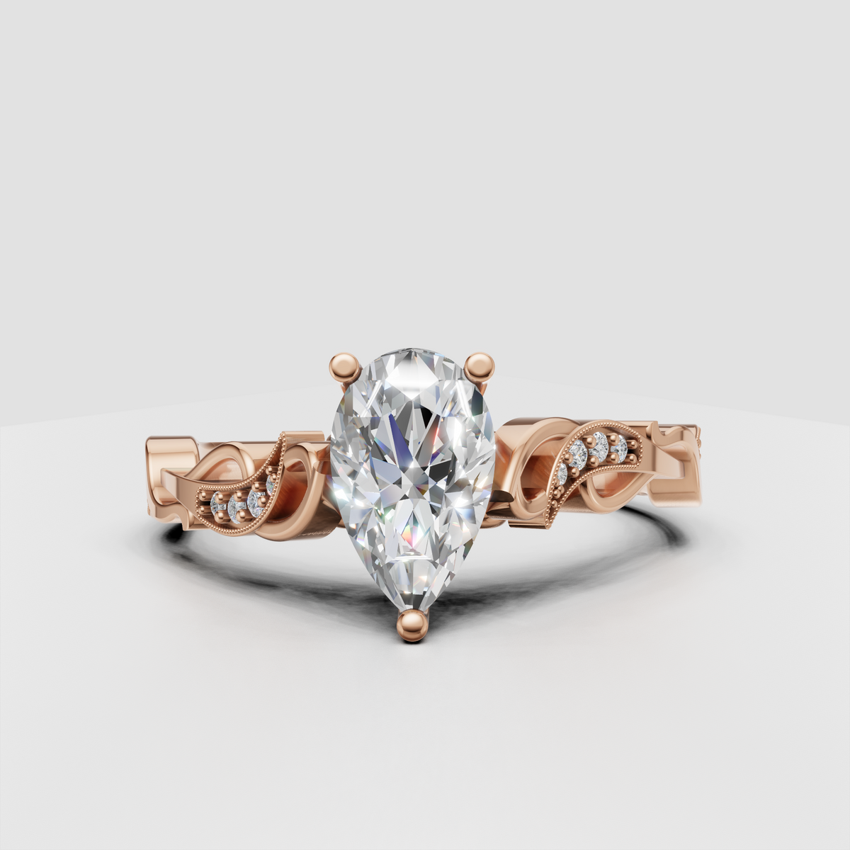 Pear shaped diamond engagement ring with sculptural filigree gallery