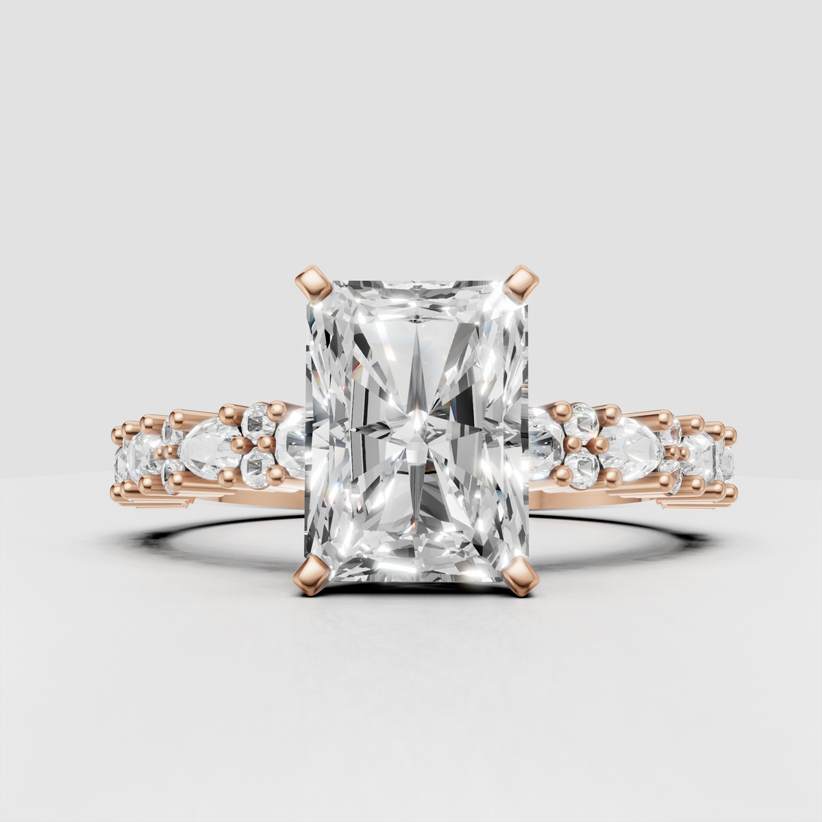 Radiant diamond engagement ring with alternating side stones