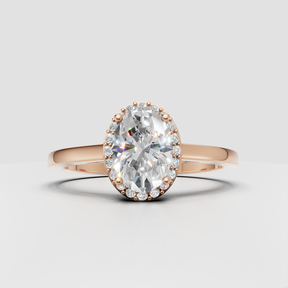 Luxury oval diamond ring with four-prong center setting and halo