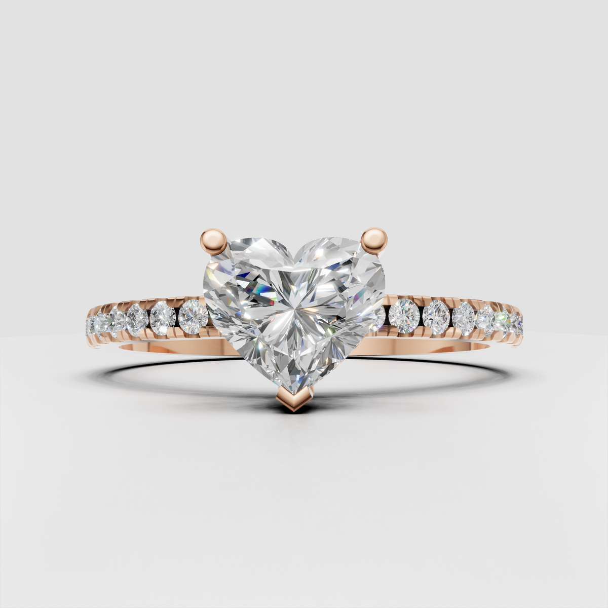 Gold heart cut diamond ring with pavé shoulders