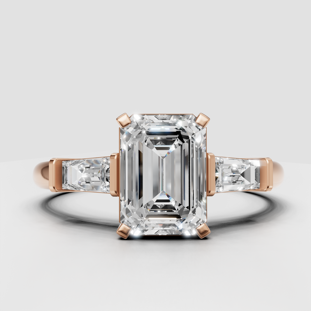 Contemporary emerald cut diamond ring with rectangular side stones