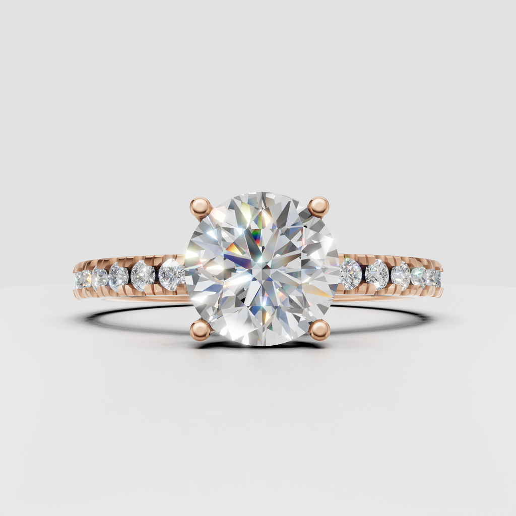 Four-prong round diamond solitaire ring with pavé shoulders