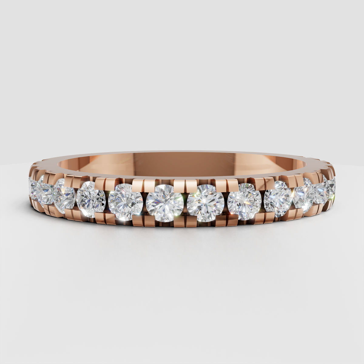 Sophisticated round diamond eternity band in polished metal