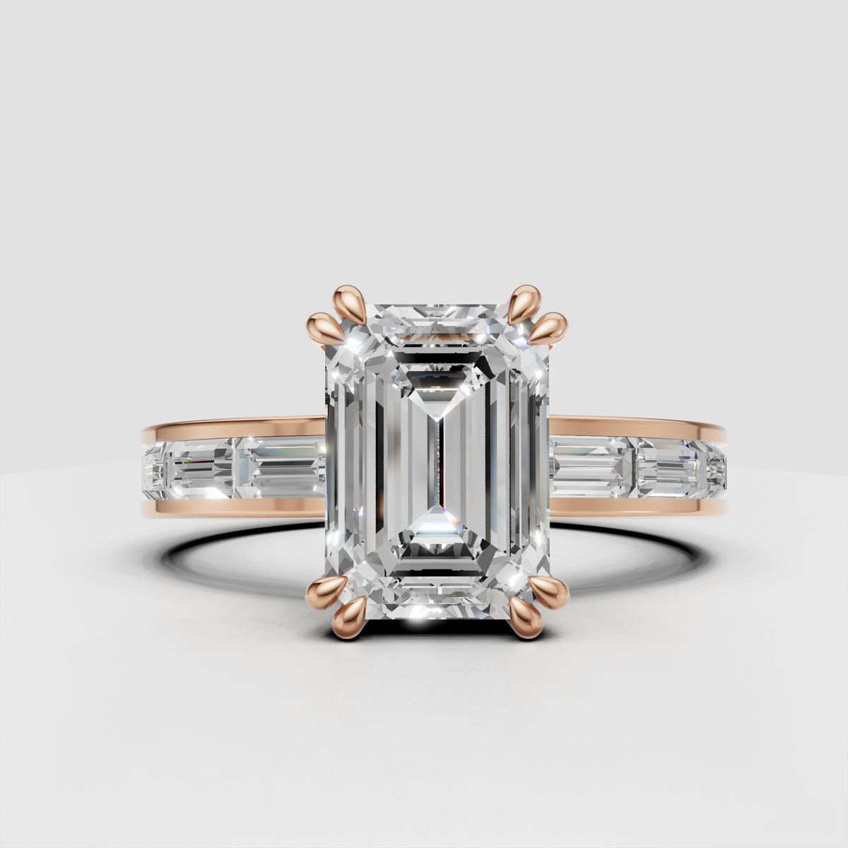 Emerald cut diamond ring featuring elongated center stone and baguette accents