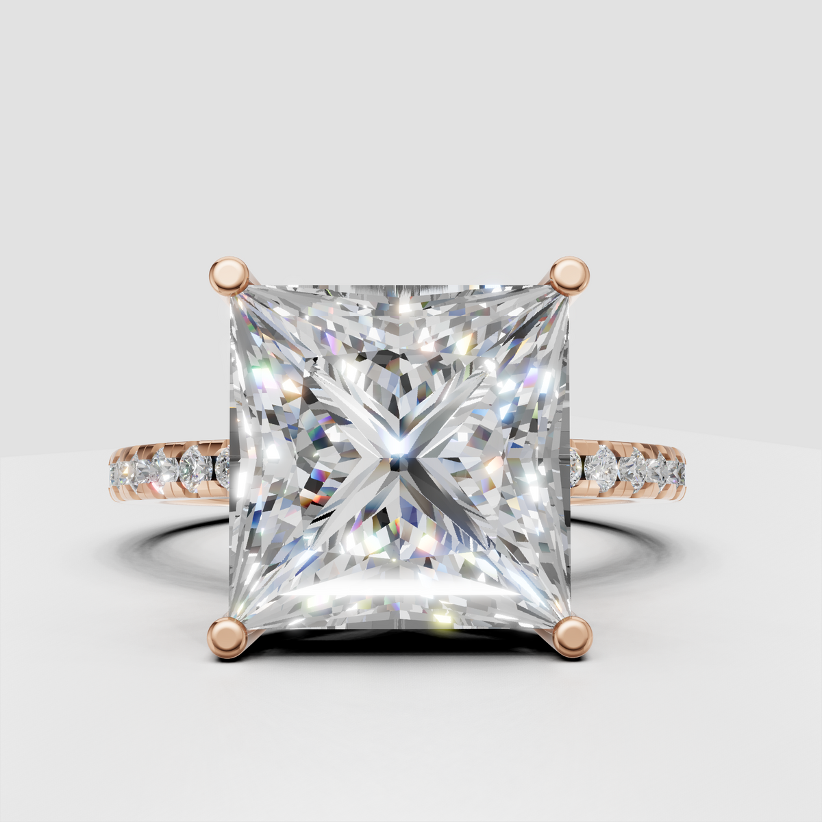 Hidden halo princess cut diamond ring with elevated cathedral setting and pave band.