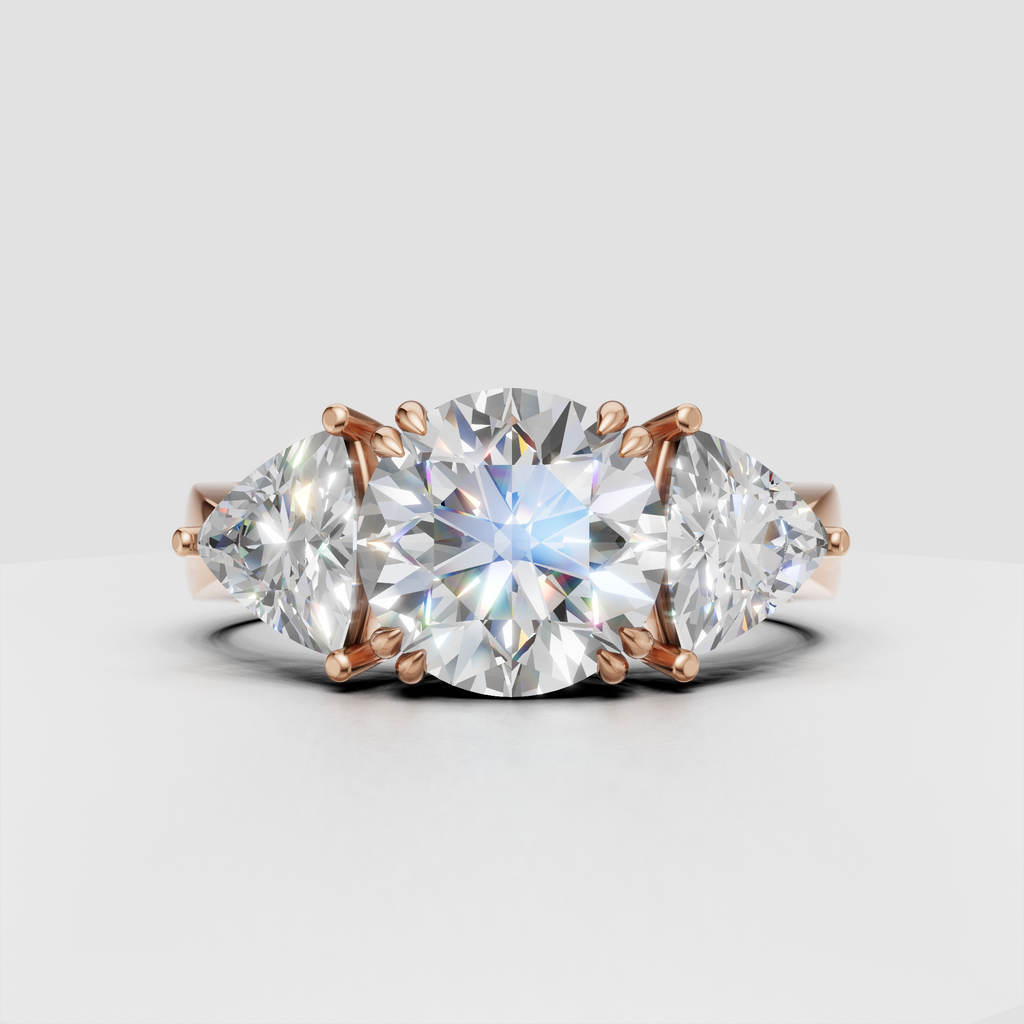 Luxury round diamond engagement ring with symmetrical Trillion side stones